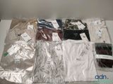 a lot of men ' s shirts on a table