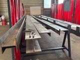 an image of a bench in a warehouse with red curtains