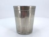 stainless steel waste bin on white table with white background