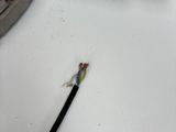 a close up of a piece of metal with wires attached to it