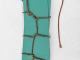 a close up of a book with a rope wrapped around it
