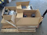 many boxes of electronic equipment sitting on a pallet