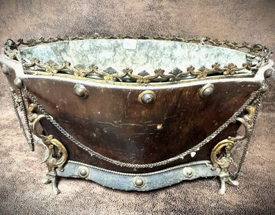 a large metal bowl with chains and chains around it