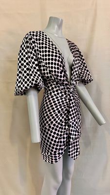 a mannequin wearing a black and white checkered dress on a mannequin mannequin