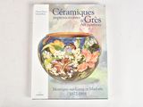 a book with a picture of a vase with flowers on it