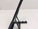 a black tablet on a stand on a white surface