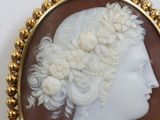 a close up of a picture of a woman with a flower in her hair