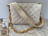 a white louis vu bag on a marble surface