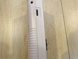 a white nintendo wii game controller sitting on a wooden floor