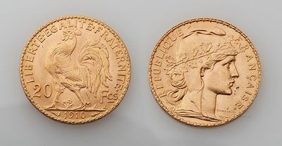 two gold sovereigns, one of which has a head of a woman and one of which has a head