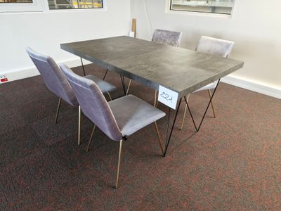a table and chairs that are in a room