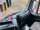 a view of the inside of a vehicle from the driver ' s seat