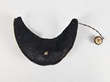 a small black object on a white surface