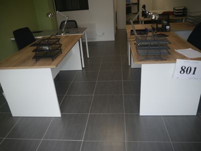 a kitchen with a stove top and a sink in the middle of the room