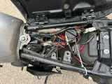 a motor bike that has a bunch of wires in it