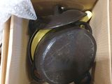 a box with a black object in it and a yellow object in it