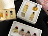 a lot of perfumes that are sitting on a table