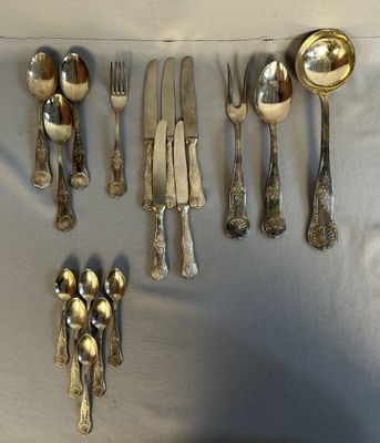a lot of silver spoons and forks on the table