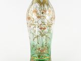 a glass vase with a floral design on it
