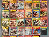 the covers of many comics are lined up on the wall