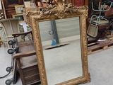 a mirror that is sitting on the floor in a room