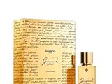 a bottle of perfume sitting next to a box with writing on it