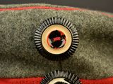 a close up of a hat with two buttons on it