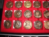 a red case with a lot of coins in it
