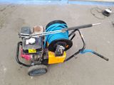 a blue hose attached to the side of a machine