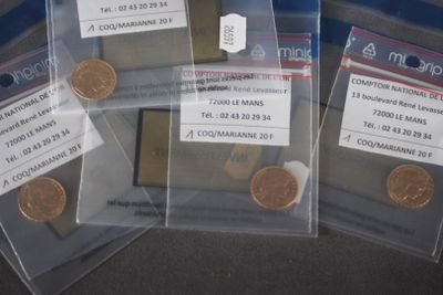 three bags of coins sitting on top of a table next to each other