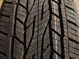 the tire of a car is shown on a wooden surface