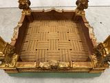 an image of a gold tray with a lion head on it