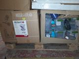 a box with a bunch of items in it sitting on a pallet