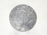 a black and white photo of a marble ball