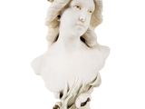 an image of a busturine of a woman with a flower in her hair