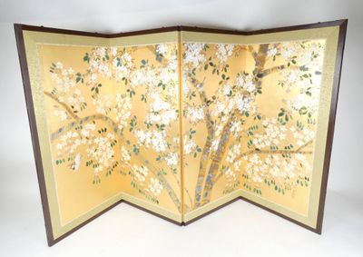a folding screen with flowers and leaves on it