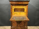 an old wooden desk with a drawer on top of it