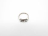a white gold ring with five diamonds on a white background