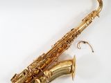 an image of a saxophone with a gold plated body on a white background