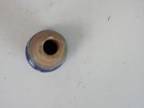 a blue and white vase sitting on a white table