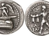 a silver coin with an image of a man and a woman on it
