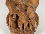 an image of a wooden sculpture of an eagle with a bird on it ' s head