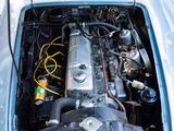 a small engine in the back of a blue car