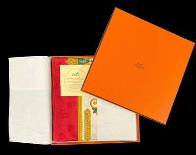 a close up of a box with a napkin and napkins in it