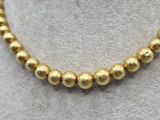 a close up of a necklace on a mannequin mannequin