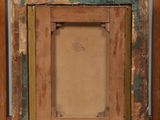 an old wooden easel with a painting on top of it