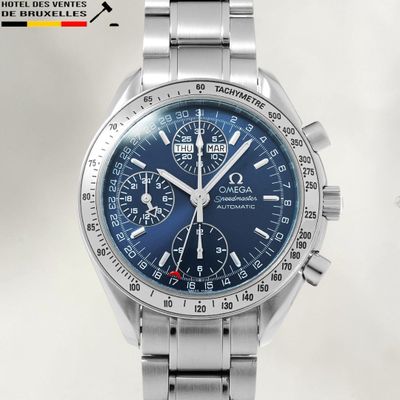 an image of a close up of a wrist watch with a blue dial