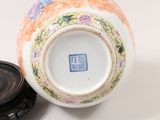 a vase with a lid sitting on a table