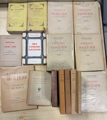 several books are stacked on top of each other on a table