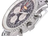 a close up of a watch with a chain around it